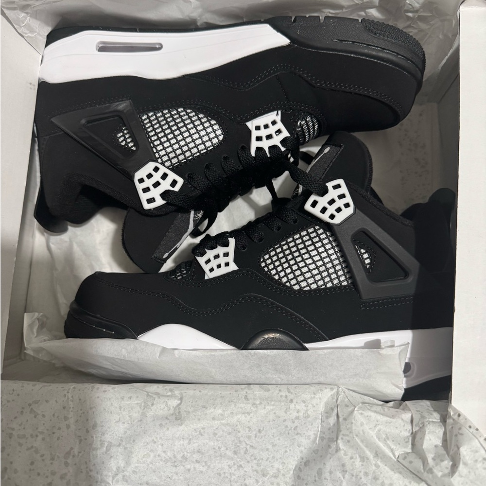 Black and White Jordan 4 Sneakers